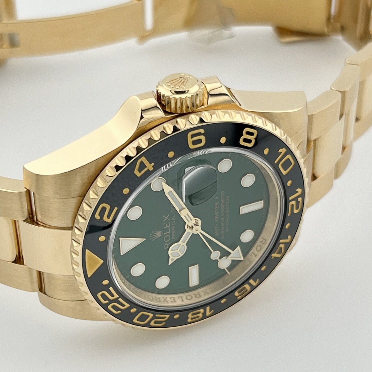 Rolex GMT-Master II 116718LN Yellow Gold Green Dial Black Bezel
